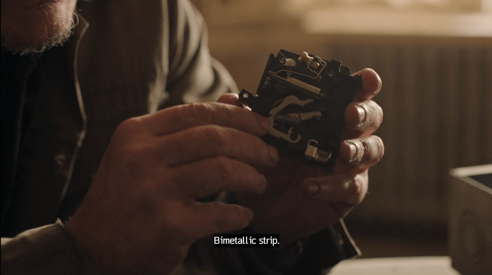 Joel explaining a bimetallic strip while taking apart a circuit in The Last of Us Season 2